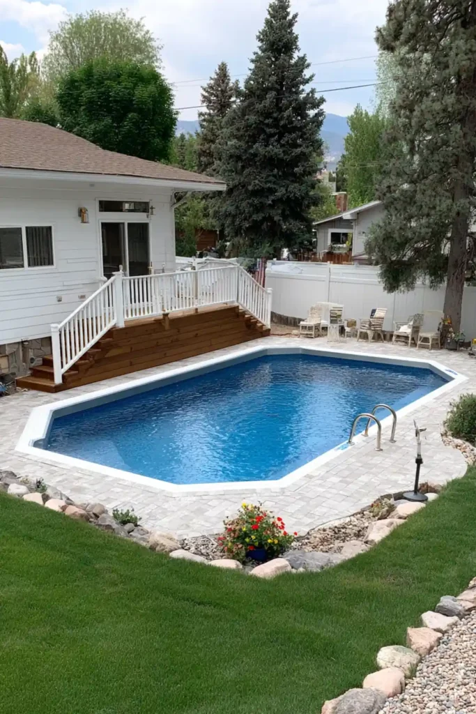 Compact semi in-ground pool in a small backyard with simple entry deck

Oval Vista Semi In-Ground Pool with Caribbean Teal Liner for a Softer Pool Shape