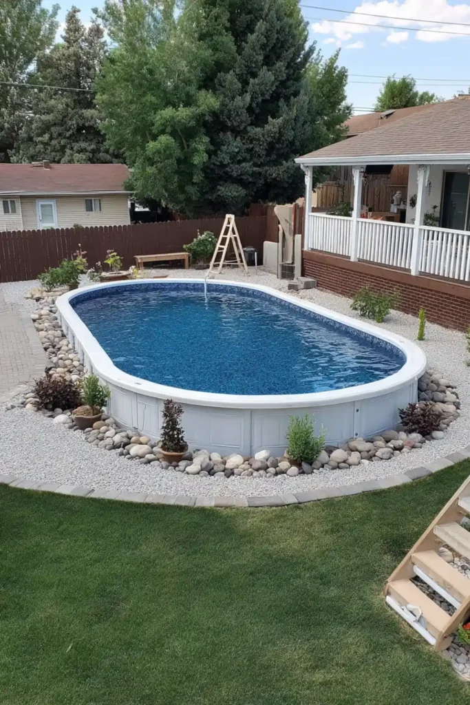 Semi in-ground pool with soft blue Bella Vista liner and gravel edge in backyard