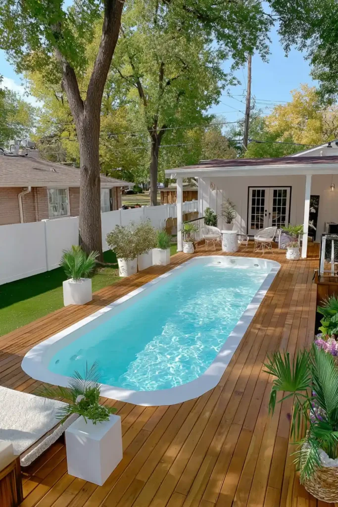 Landscaping Around Above-Ground Pools Long wooden lounge deck extending beside an above-ground pool for relaxation