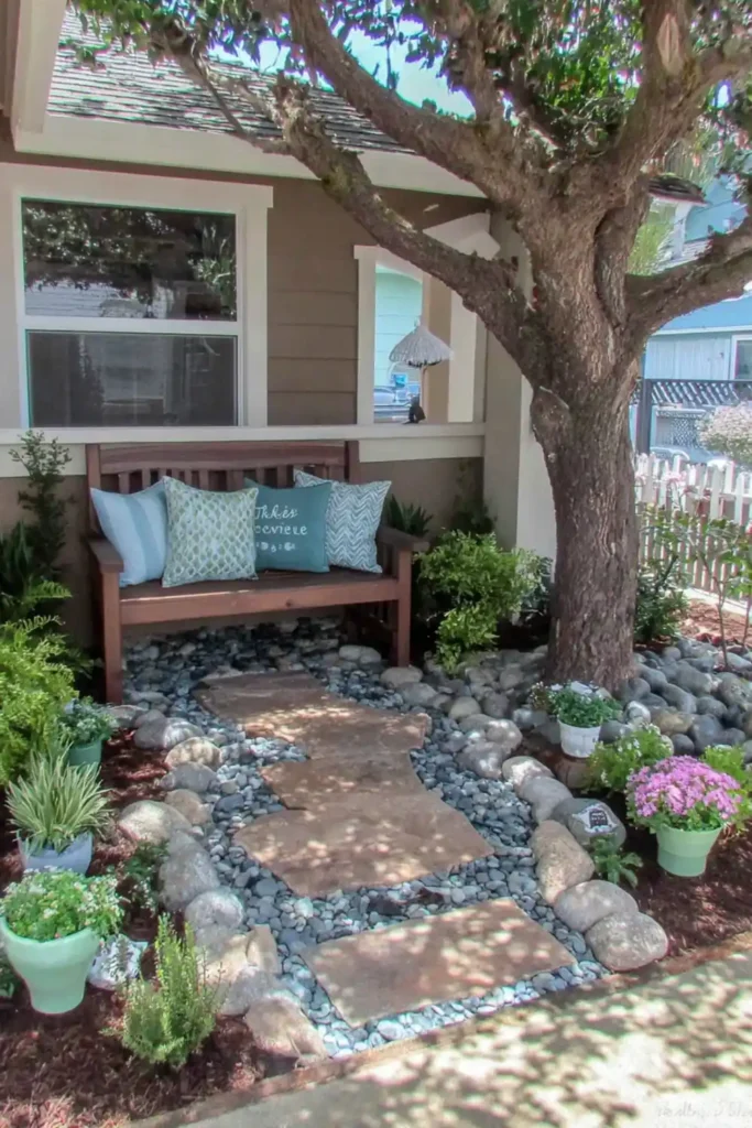 tiered planters with flowers in a small front yard