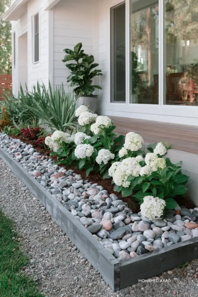 White Stone Landscaping Ideas for a Clean, Modern Outdoor Space 19 White flower garden with white gravel creating a calm monochrome look