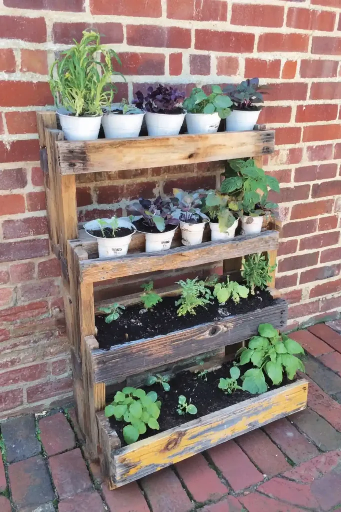 Raw wood 4-tier ladder pallet garden planters against a red brick wall