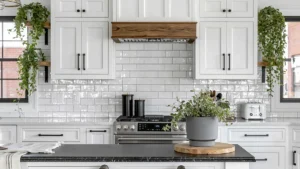 Bright white kitchen with styled countertops, wood accents, black canisters, a white toaster, and greenery for kitchen counter decor styling.