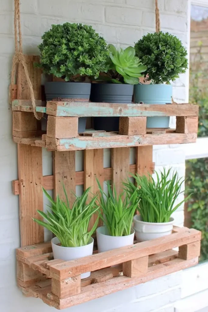 Minimalist hanging pallet garden with light wood frames and simple potted plants