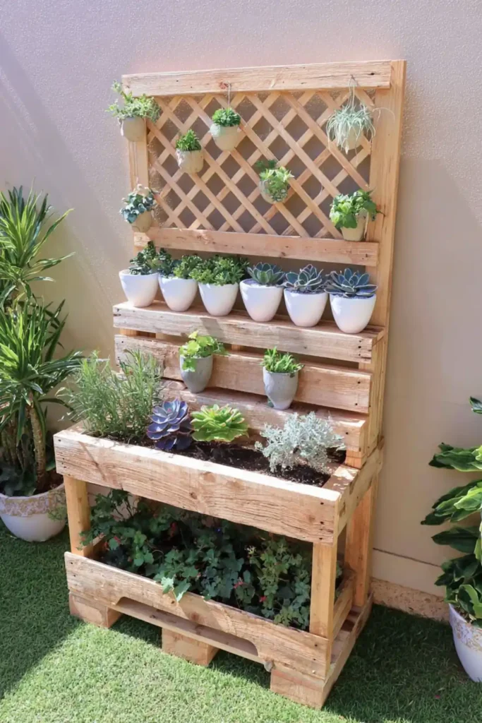 Tiered raised pallet garden bed with lattice trellis and small green plants