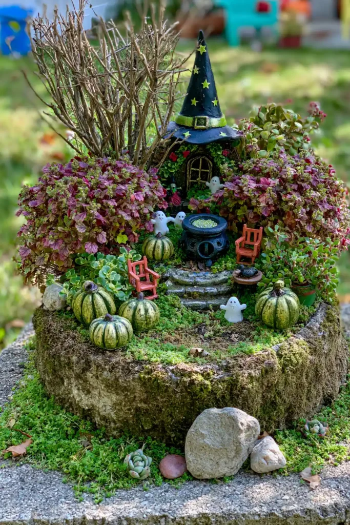 DIY Outdoor Fairy Garden Ideas for Tiny Backyard, Patio, and Seasonal Displays 11 Autumn Halloween fairy garden with purple foliage, small pumpkins, orange chairs, ghost shapes, a wizard-hat decoration, and green groundcover.