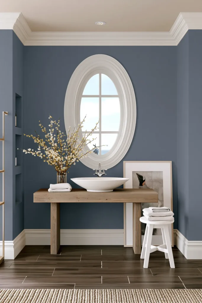 Whole House Cohesive Paint Palettes for a Calm, Connected Home 4 Bathroom vanity with deep blue walls and wood accents for a quiet blue paint palette