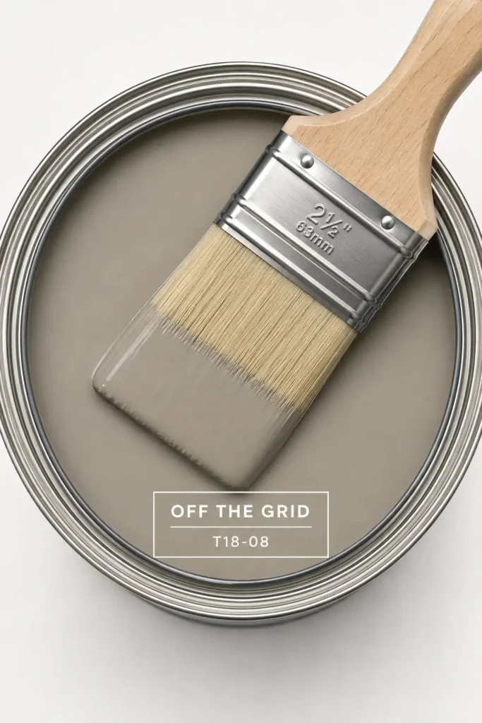 Trend Color Spotlight: Off the Grid Paint Inspiration for Warm, Modern Rooms 4 Open paint can with warm gray-beige Off the Grid paint and brush for floor-to-ceiling paint inspiration.