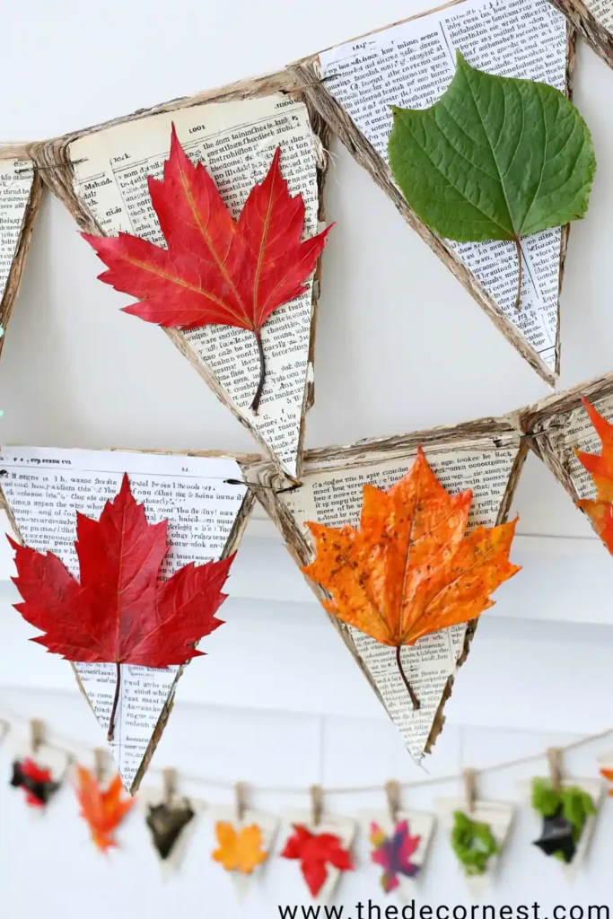 Air dry clay fall leaf bowl craft shaped like a large green leaf with visible veins on a wooden table.