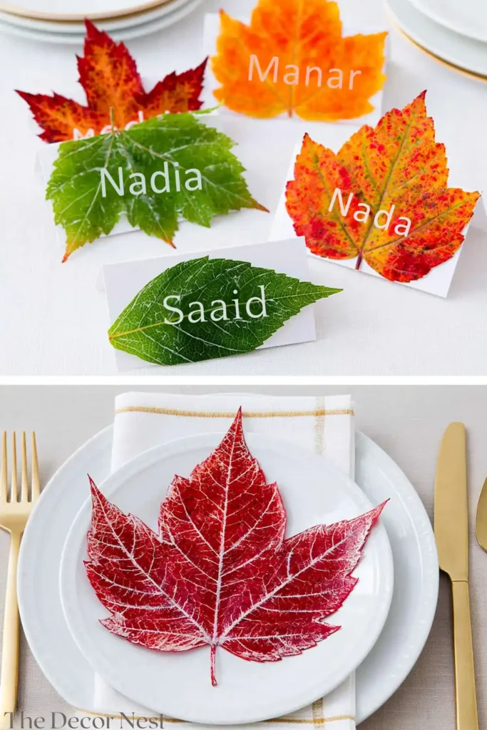 Fall leaf place cards with handwritten names arranged on a dining table with a white plate and gold flatware.