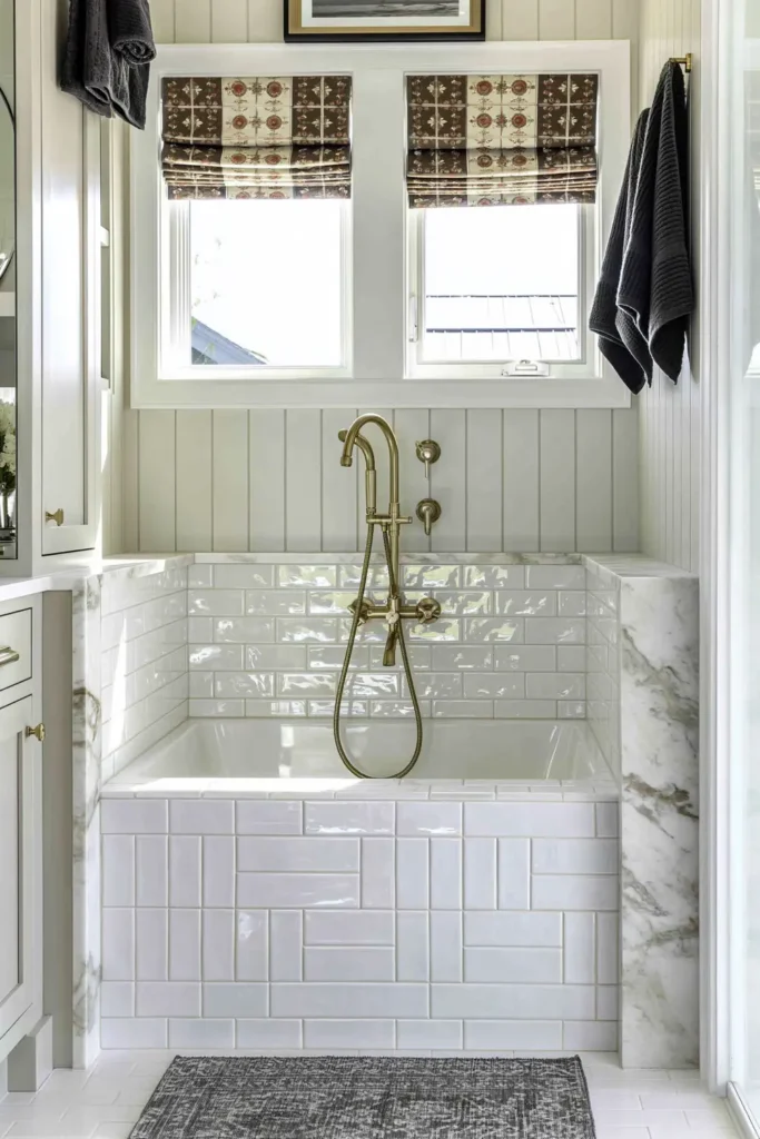 Country-style dog-washing station with glossy white tile, marble-look trim, and brass fixtures.
