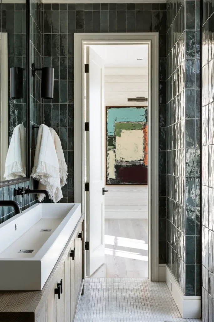30 Modern Farmhouse Bathroom Decor Ideas for a Warm, Updated Space 23 Rich modern farmhouse bathroom with deep teal wall tile, a light wood vanity, white trough sink, and matte black fixtures.